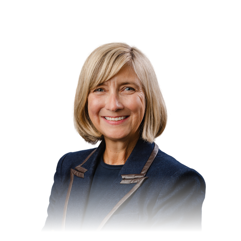 Portrait of Holly Benson, Founder and CEO of Talent Pronto, smiling in a navy jacket